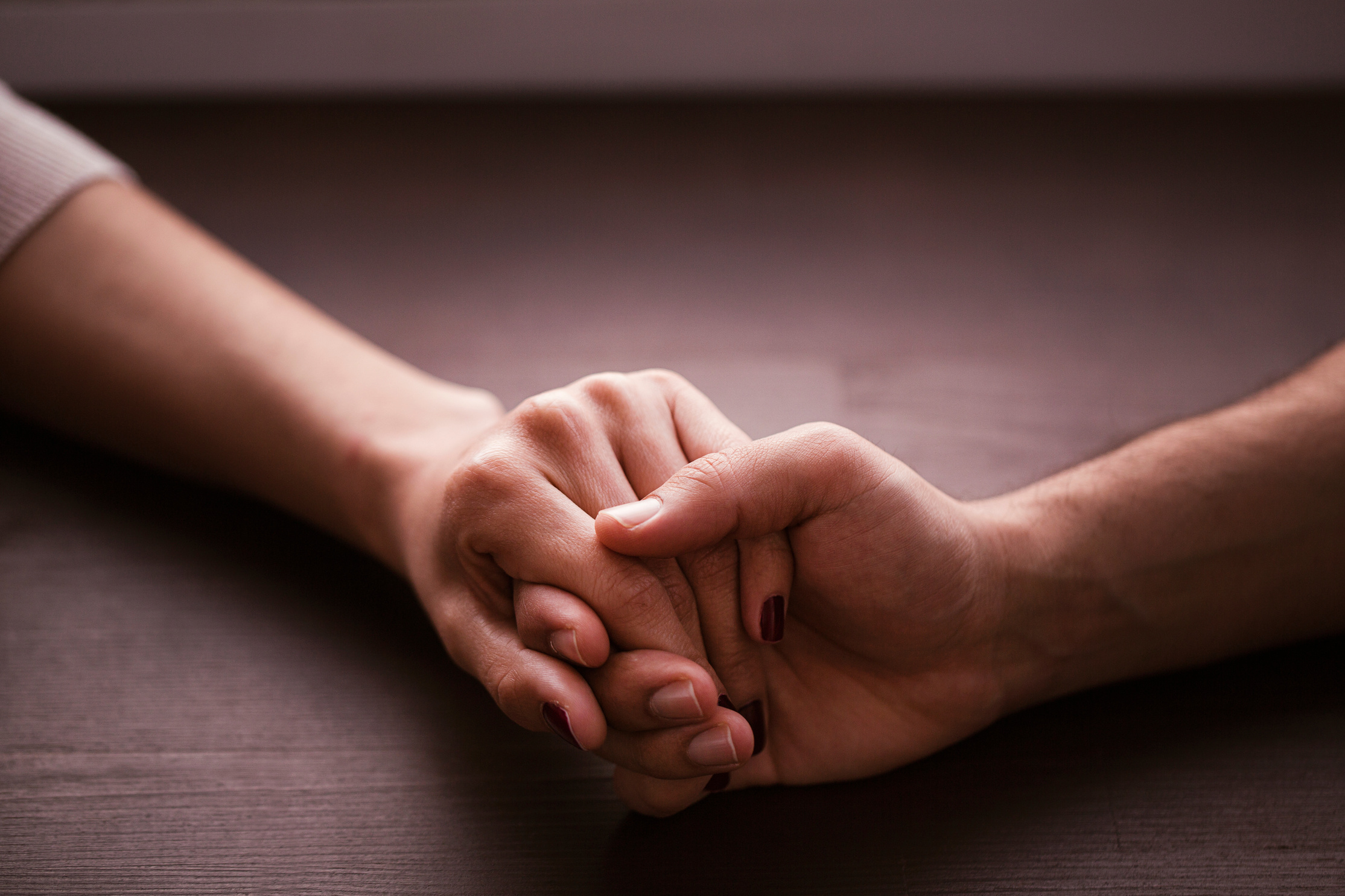 Couple holding hands